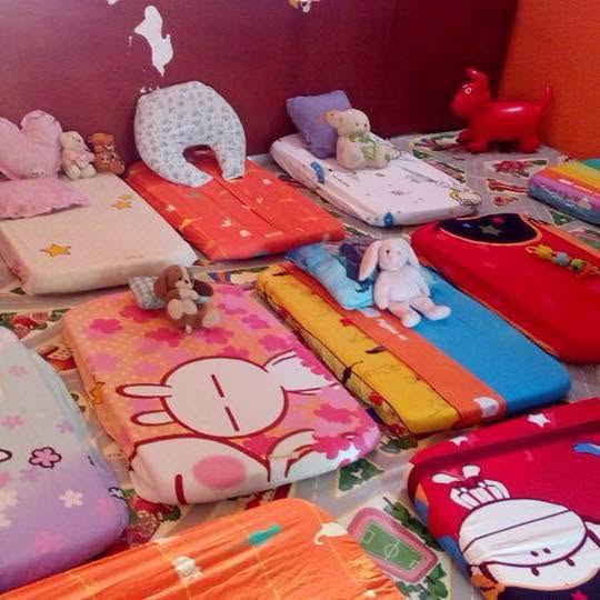 Naptime mats set up in the Seraphic Kidz creche room